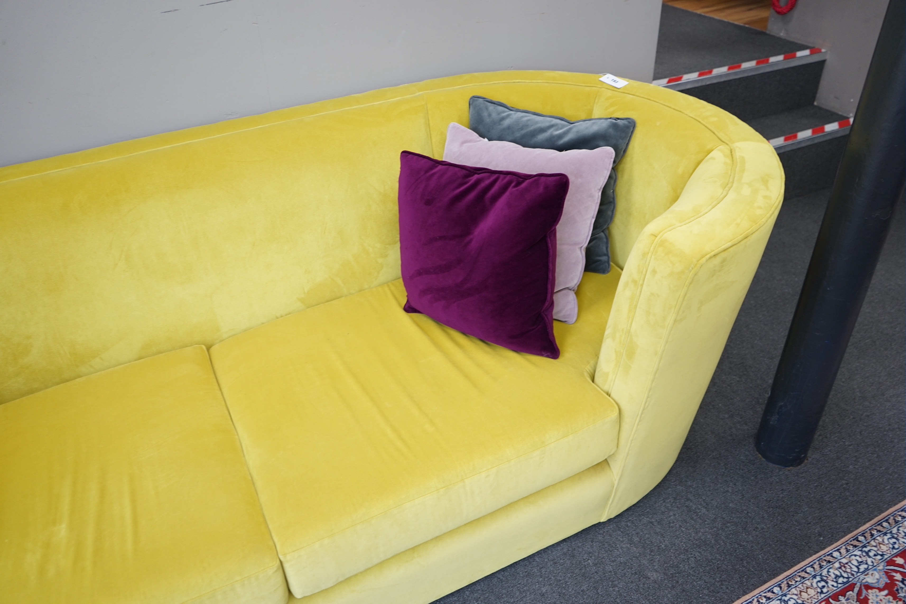 A contemporary Conran tub framed settee, upholstered in Italian Wattle velvet, with up to date fire safety standards, length 250cm, depth 102cm, height 78cm